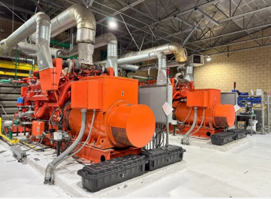 Row of paralleled generator units in a cogeneration plant